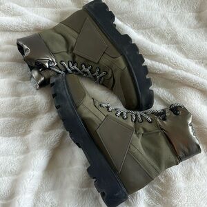 Stylish casual boots that are green colored platform with bold laces
